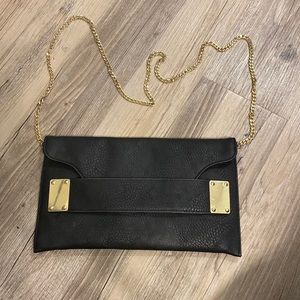 Charming Charlie black clutch with gold details